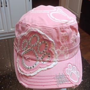 Women's pink and white baseball cap with paw prints some in rhinestones.
